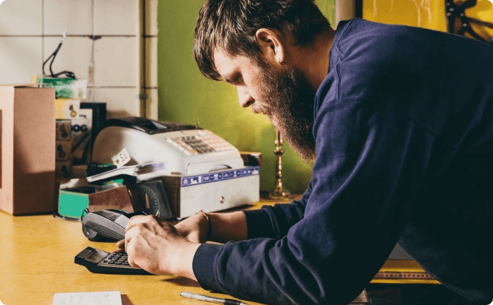 Man using calculator