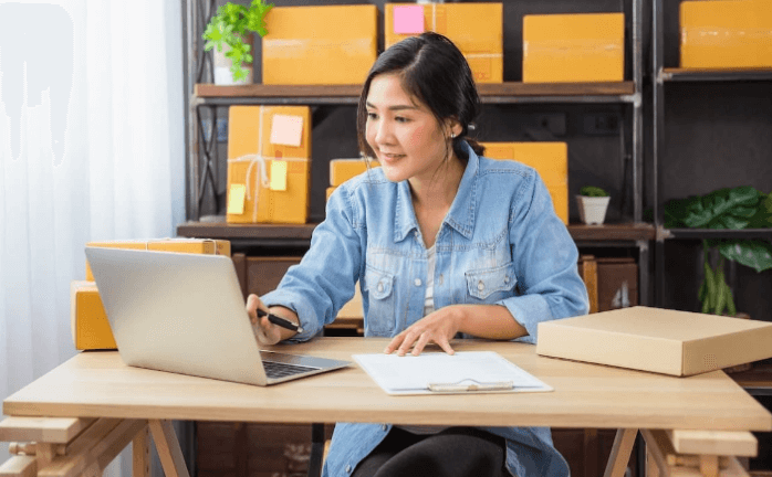 Woman working and looking at notebook